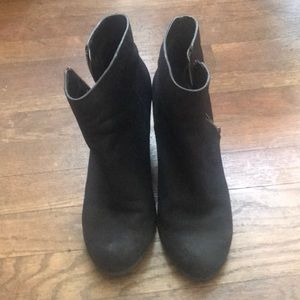 Black leather ankle bootie with a heel